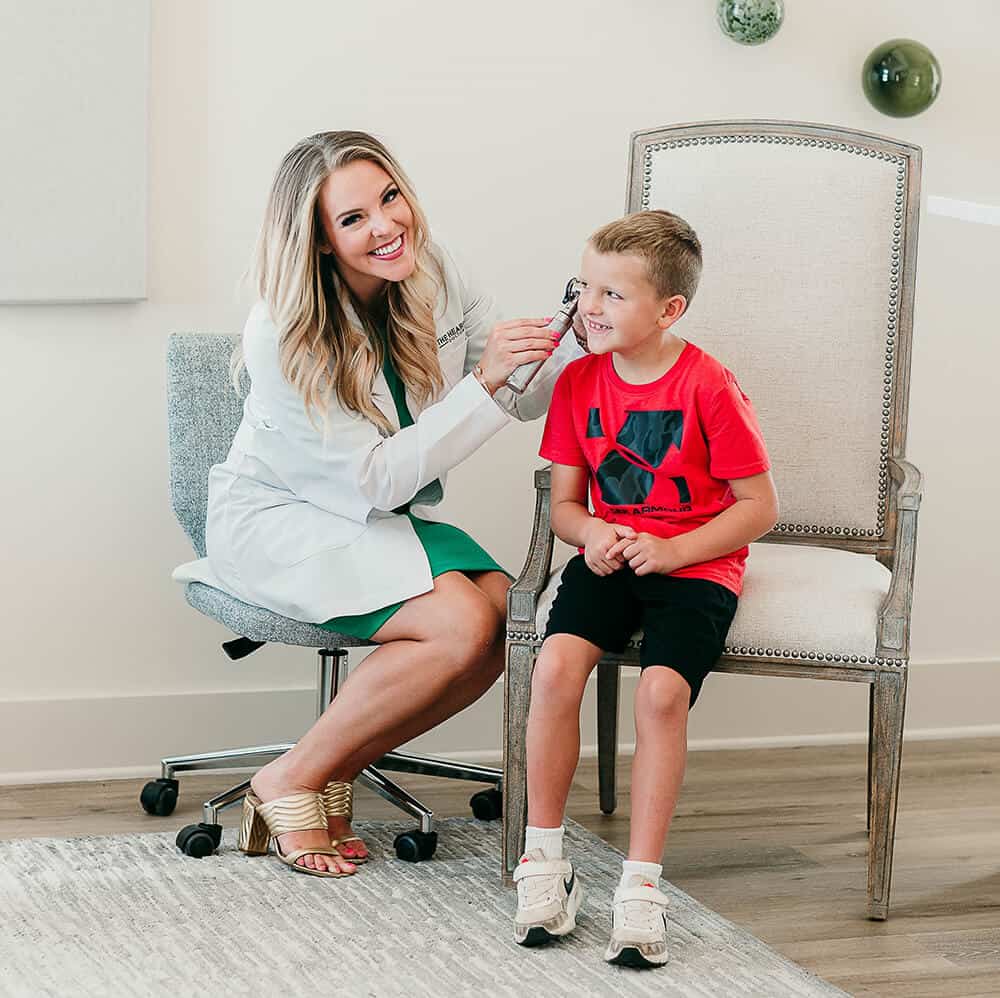 Hearing Services | Image of Dr. Black treating a boy